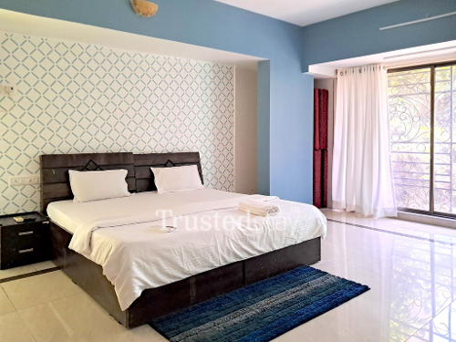 Bedroom one of TrustedStay Moksh Service Apartment in Malad East, Mumbai